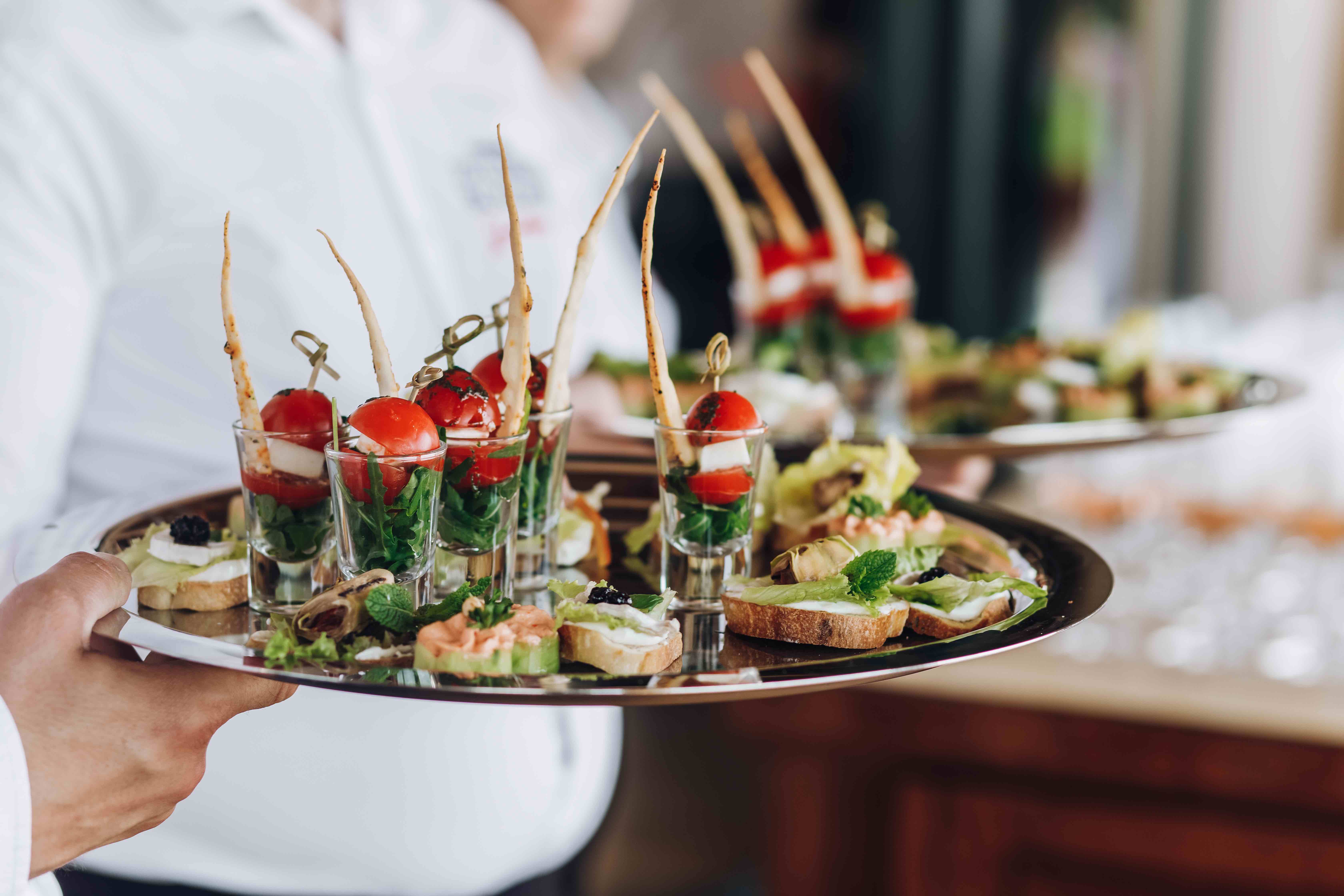 Waiter Keeps Salver With Snacks